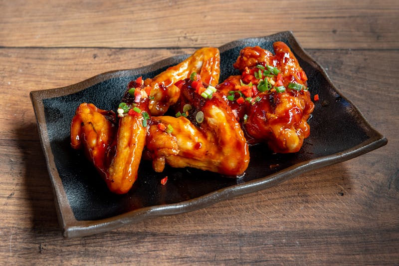 Honey garlic glazed wings with sticky caramelized coating